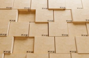 Rows of organized, stacked, cardboard storage boxes